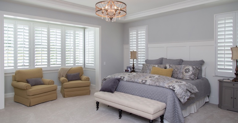 Plantation shutters in Las Vegas bedroom.